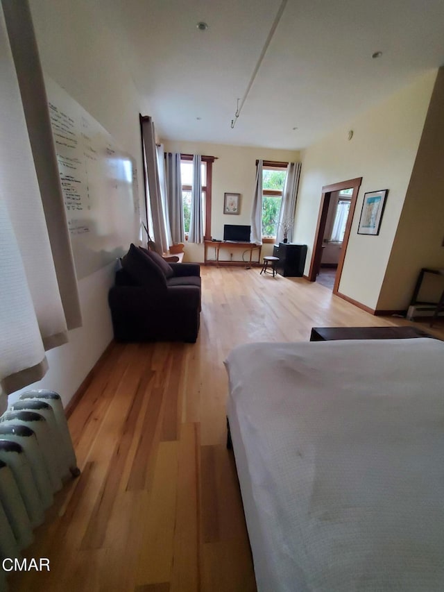 bedroom with light wood-type flooring