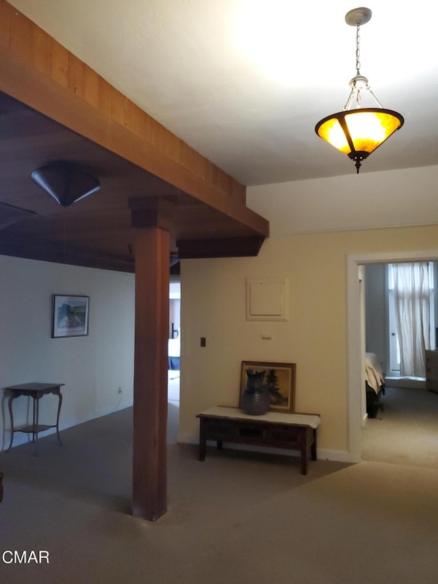 basement featuring light colored carpet