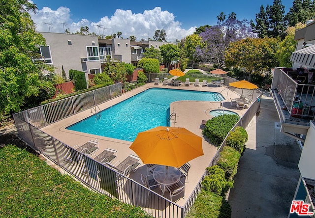 view of swimming pool featuring a patio area