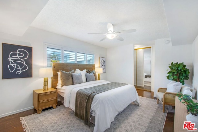 bedroom featuring hardwood / wood-style floors and ceiling fan