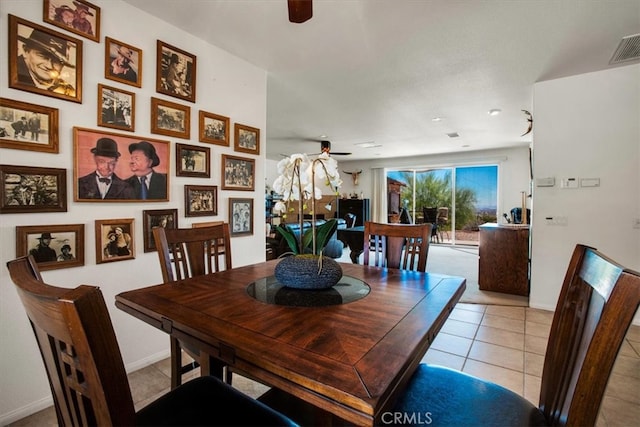 dining room with light tile patterned floors and ceiling fan