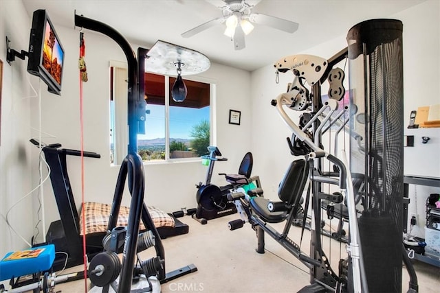 exercise room with ceiling fan