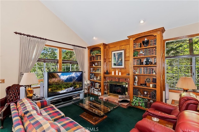 living room featuring a fireplace and vaulted ceiling