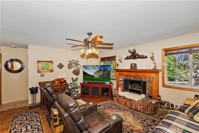 30184 Sky Line Dr, Running Springs, CA 92382 - living area featuring wood finished floors, a ceiling fan, and a brick fireplace
