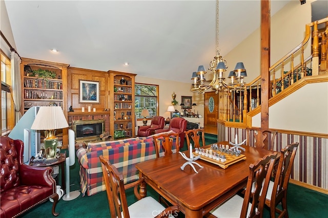 carpeted dining room with a notable chandelier, a fireplace, and lofted ceiling