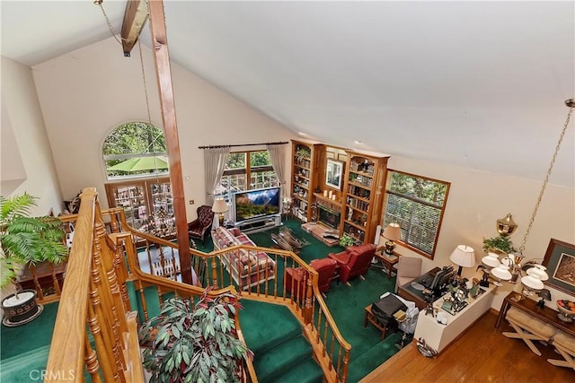 30184 Sky Line Dr, Running Springs, CA 92382 - living area featuring beam ceiling, wood finished floors, healthy amount of natural light, and high vaulted ceiling