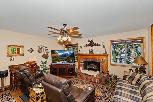 30184 Sky Line Dr, Running Springs, CA 92382 - living room featuring wood finished floors, ceiling fan, and a brick fireplace