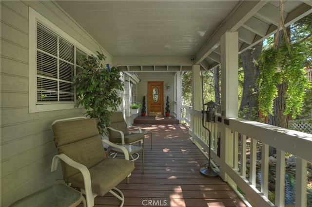 wooden deck featuring covered porch