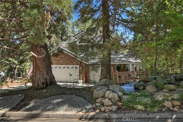30184 Sky Line Dr, Running Springs, CA 92382 - view of front of house with an attached garage and brick siding