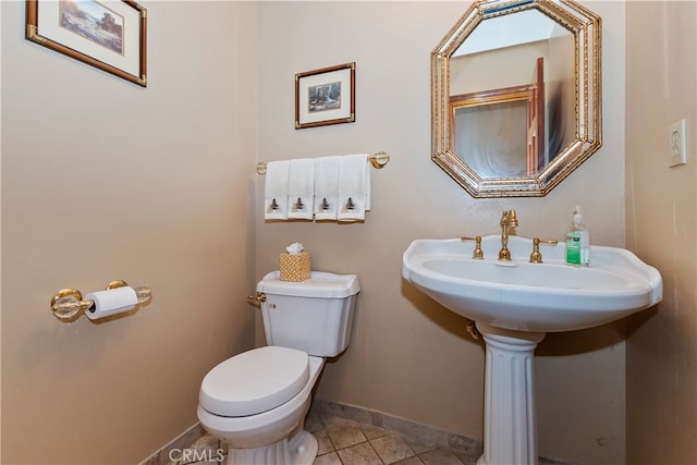 bathroom featuring tile patterned flooring and toilet