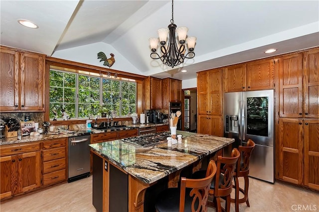 30184 Sky Line Dr, Running Springs, CA 92382 - kitchen with appliances with stainless steel finishes, brown cabinets, stone counters, lofted ceiling, and recessed lighting
