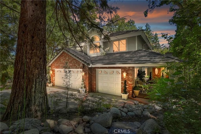 30184 Sky Line Dr, Running Springs, CA 92382 - view of front facade with brick siding, driveway, and a garage