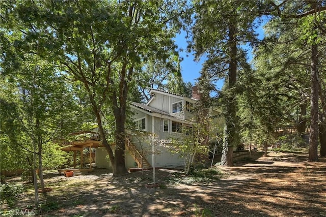 30184 Sky Line Dr, Running Springs, CA 92382 - view of side of property featuring a chimney and stairway