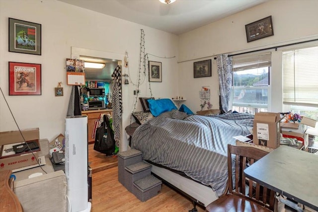 bedroom featuring light wood-type flooring and ceiling fan