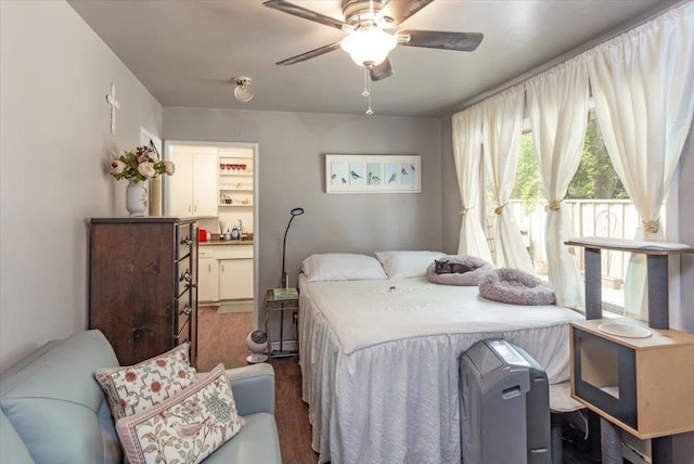 bedroom featuring ceiling fan and dark hardwood / wood-style flooring