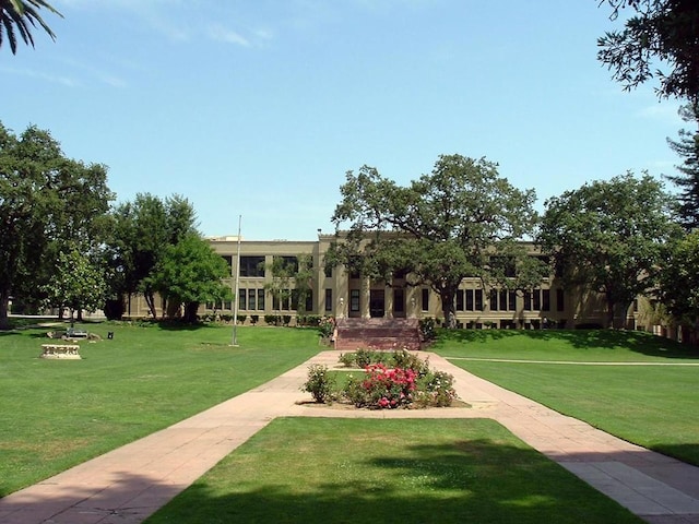 view of home's community featuring a lawn