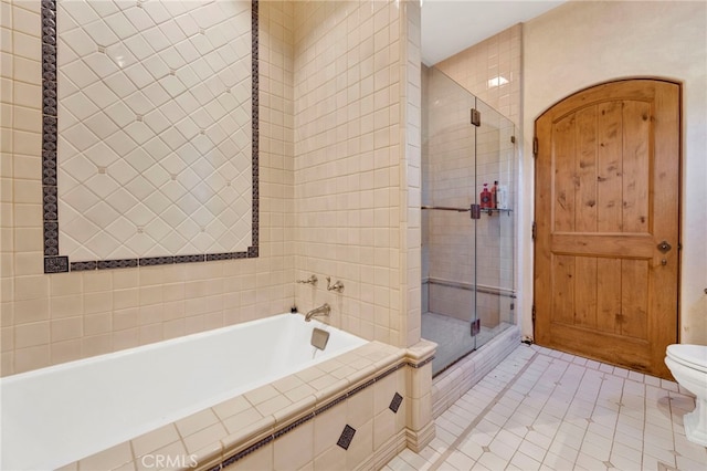 bathroom featuring tile patterned flooring and plus walk in shower