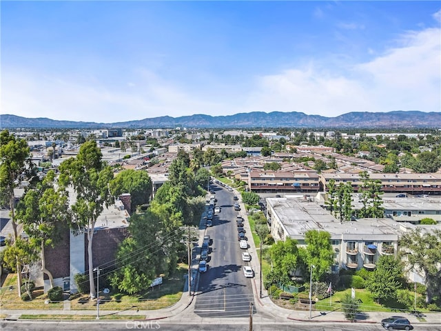 drone / aerial view featuring a mountain view