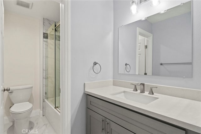 bathroom featuring visible vents, toilet, shower / bath combination with glass door, marble finish floor, and vanity