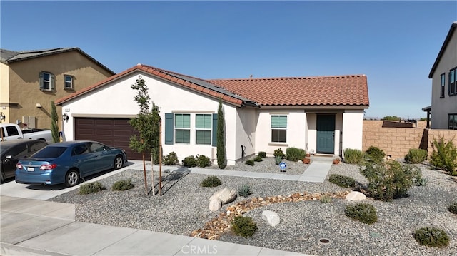 mediterranean / spanish-style home featuring a garage