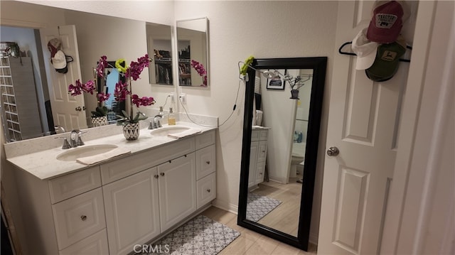 bathroom featuring hardwood / wood-style flooring and vanity