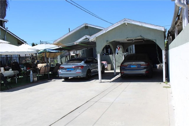 exterior space with a carport