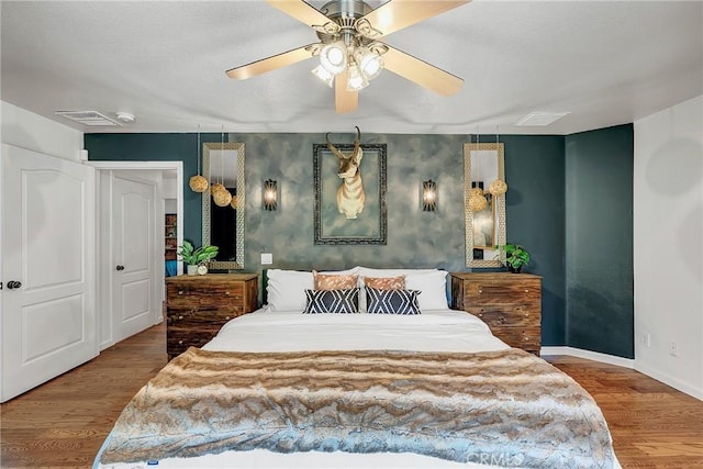 bedroom featuring ceiling fan and hardwood / wood-style floors