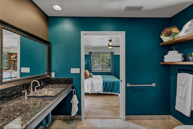 bathroom featuring tile patterned flooring and sink