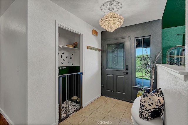 foyer entrance featuring light tile patterned floors and a notable chandelier