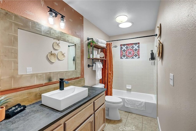 full bathroom with shower / bath combo with shower curtain, tile patterned floors, toilet, and vanity