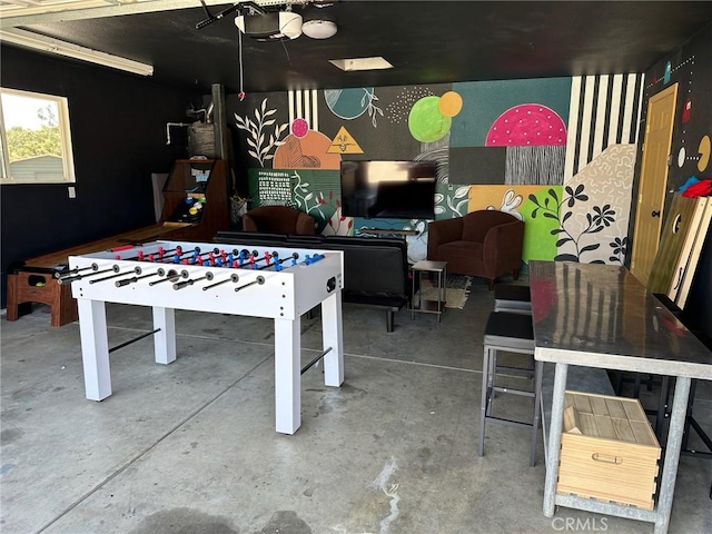 game room with concrete floors