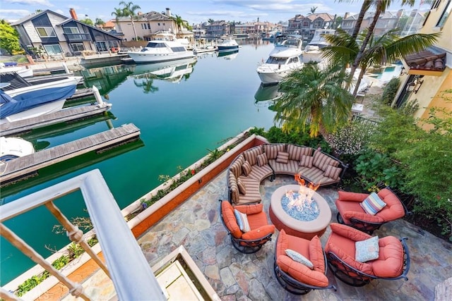 exterior space with a boat dock and a fire pit