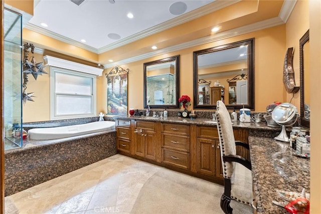 bathroom with a relaxing tiled tub, crown molding, and vanity