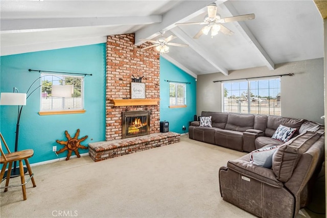 carpeted living room with vaulted ceiling with beams, ceiling fan, and a brick fireplace