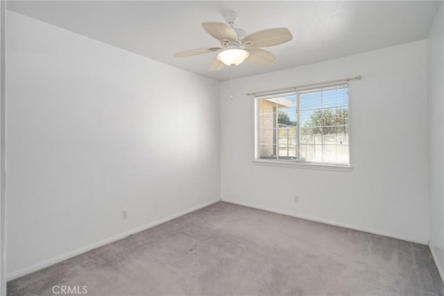 empty room with light carpet and ceiling fan