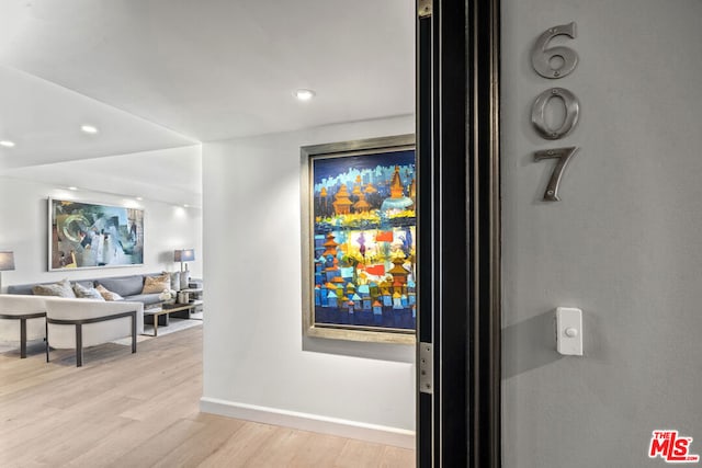 interior details featuring hardwood / wood-style flooring