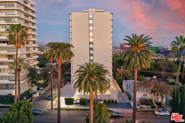 view of outdoor building at dusk