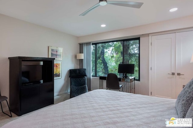 carpeted bedroom with ceiling fan