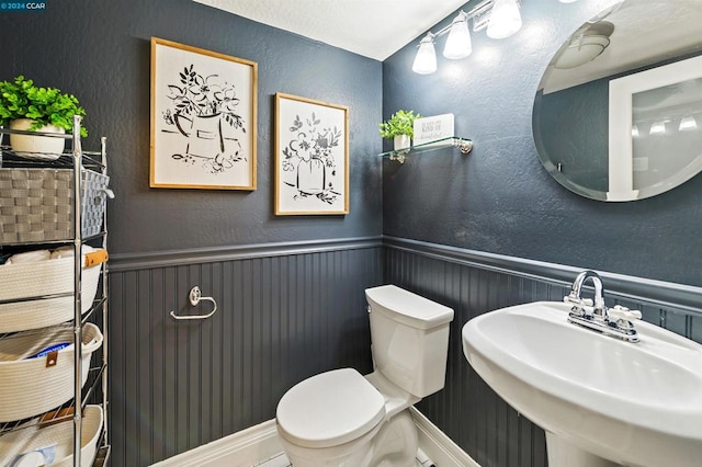 bathroom with sink and toilet