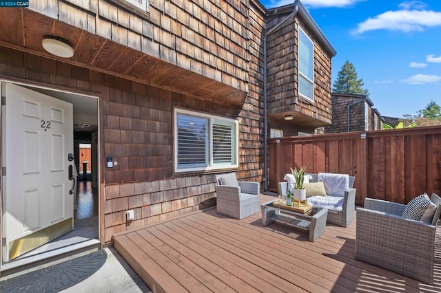 wooden deck with an outdoor hangout area