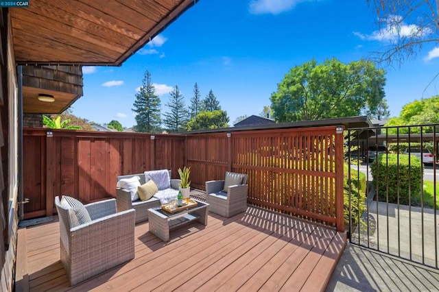 wooden deck featuring an outdoor living space