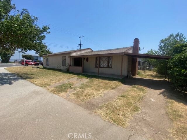 ranch-style home featuring a front yard