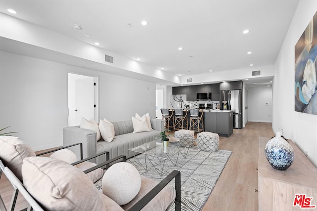 living room with light hardwood / wood-style floors