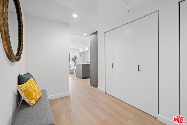 hall with light wood-type flooring