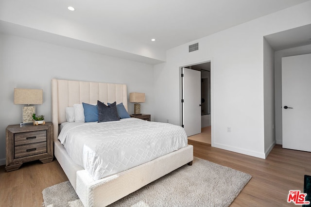 bedroom featuring hardwood / wood-style flooring