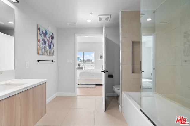 full bathroom with vanity, tile patterned flooring, toilet, and separate shower and tub