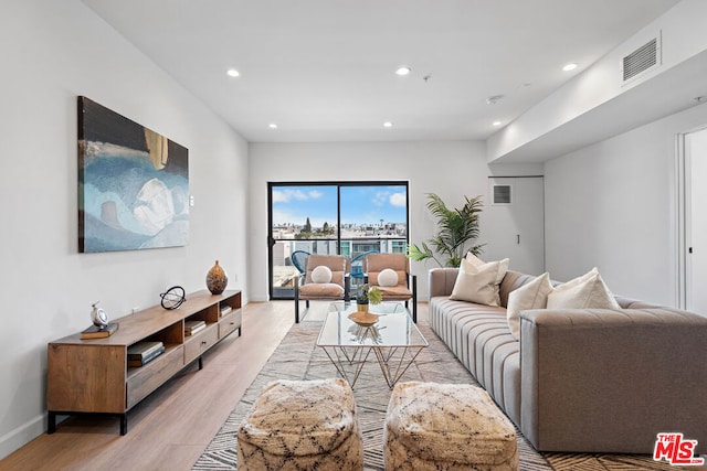 living room with light hardwood / wood-style floors