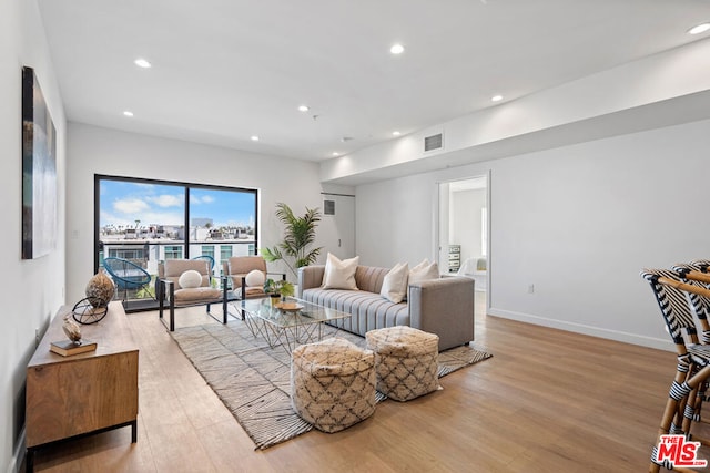 living room with light hardwood / wood-style floors