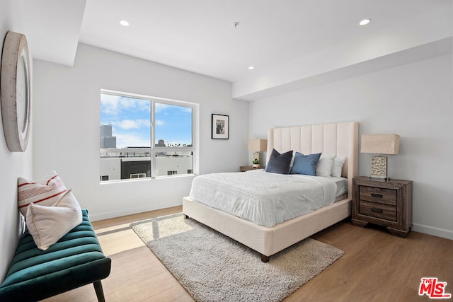 bedroom featuring wood-type flooring