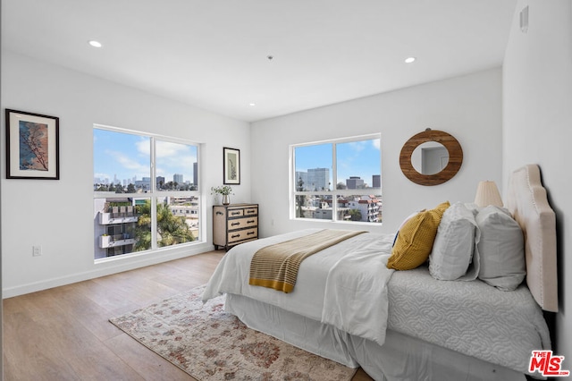 bedroom with light hardwood / wood-style floors